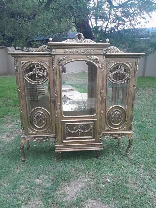 A 20th Century French Style Three Division and Large Ornately Carved and Hand-Gilded Display Cabinet