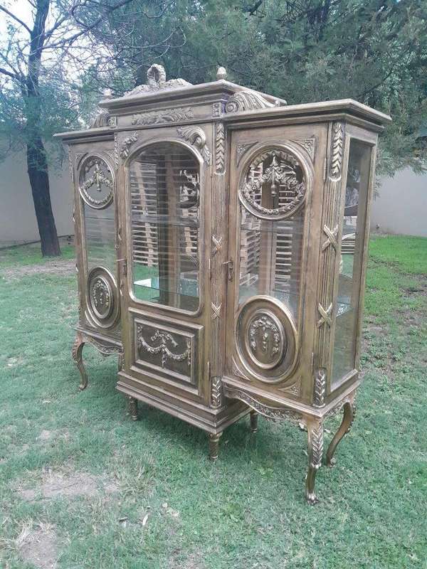 A 20th Century French Style Three Division and Large Ornately Carved and Hand-Gilded Display Cabinet