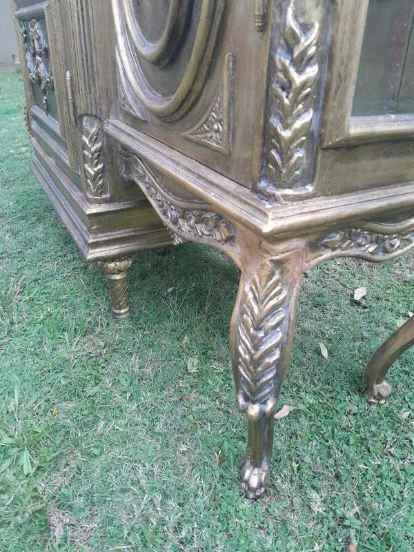 A 20th Century French Style Three Division and Large Ornately Carved and Hand-Gilded Display Cabinet