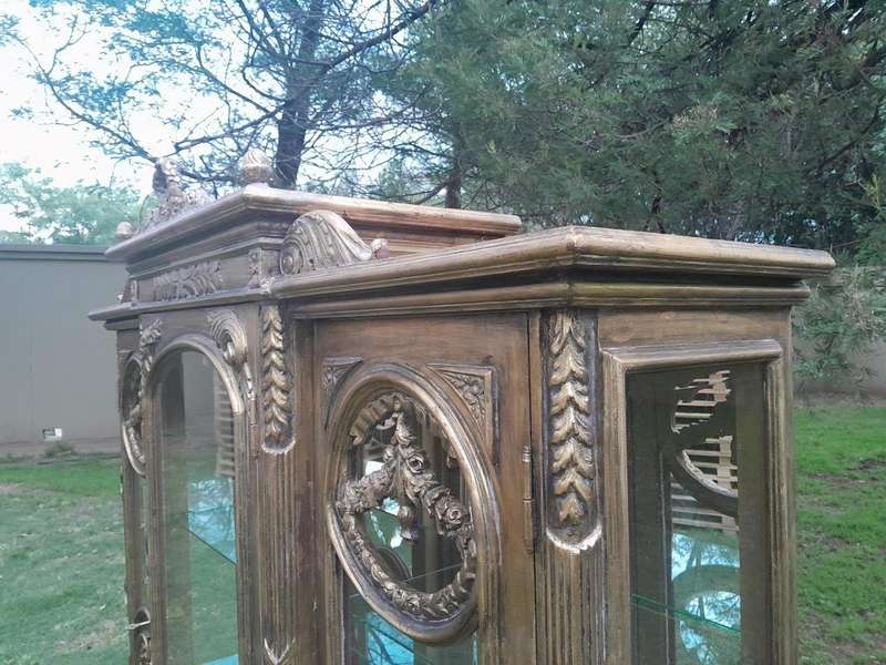A 20th Century French Style Three Division and Large Ornately Carved and Hand-Gilded Display Cabinet