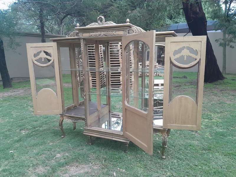 A 20th Century French Style Three Division and Large Ornately Carved and Hand-Gilded Display Cabinet