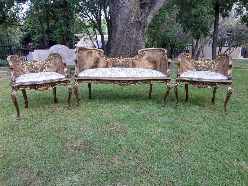 A 20TH Century French Louis XVI Style Giltwood Rattan Settee and Two Matching Bergere Chairs Upho...