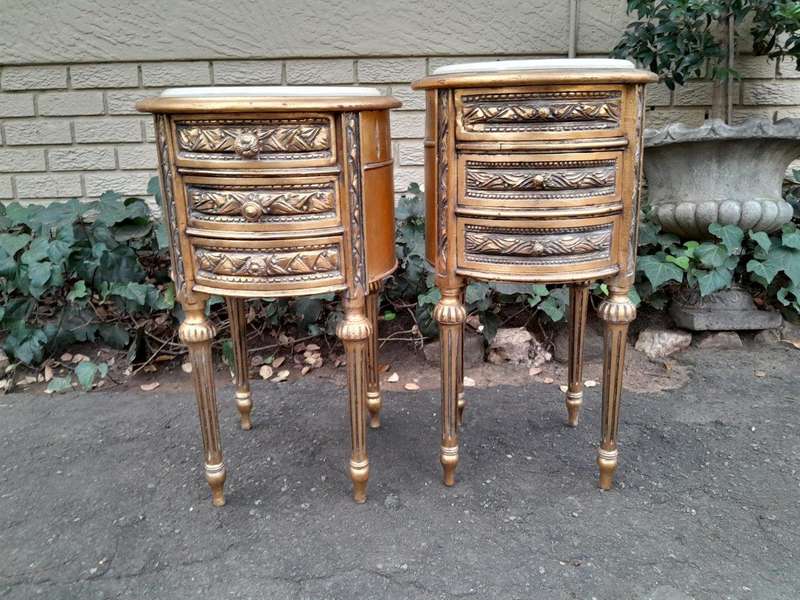 A Pair Of French Style Hand-Gilded Round Pedestals / Side Tables With Drawers And Cream Marble Tops