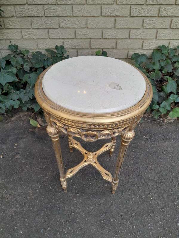 A 20th Century French Style Carved and Hand Gilded Side Table with Marble Top