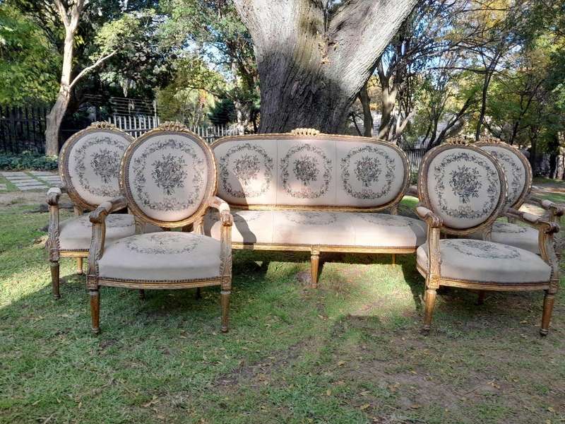 A 20th Century French Louis XVI Style Set of a Carved and Gilded Settee and Four Armchairs with T...