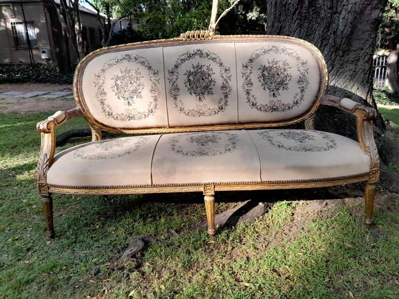 A 20th Century French Louis XVI Style Set of a Carved and Gilded Settee and Four Armchairs with T...