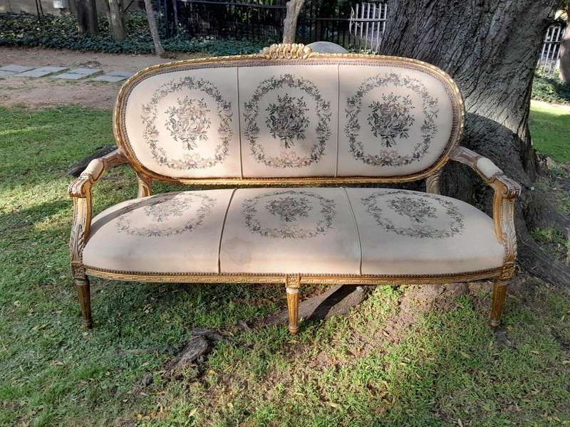 A 20th Century French Louis XVI Style Set of a Carved and Gilded Settee and Four Armchairs with T...