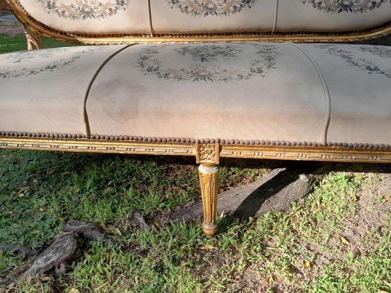 A 20th Century French Louis XVI Style Set of a Carved and Gilded Settee and Four Armchairs with T...