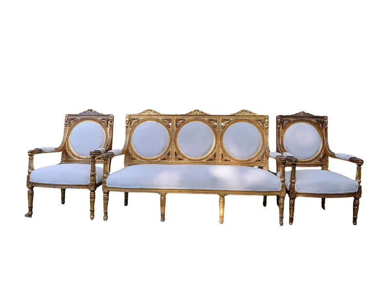 A 20th Century French Style Ornately Carved Gilt Wood Set Comprising a Settee and Pair of Armchairs