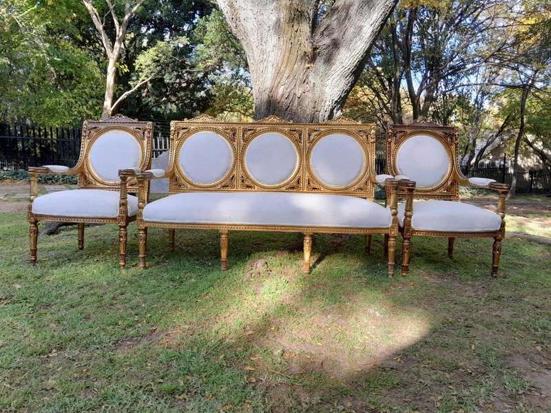 A 20th Century French Style Ornately Carved Gilt Wood Set Comprising a Settee and Pair of Armchairs