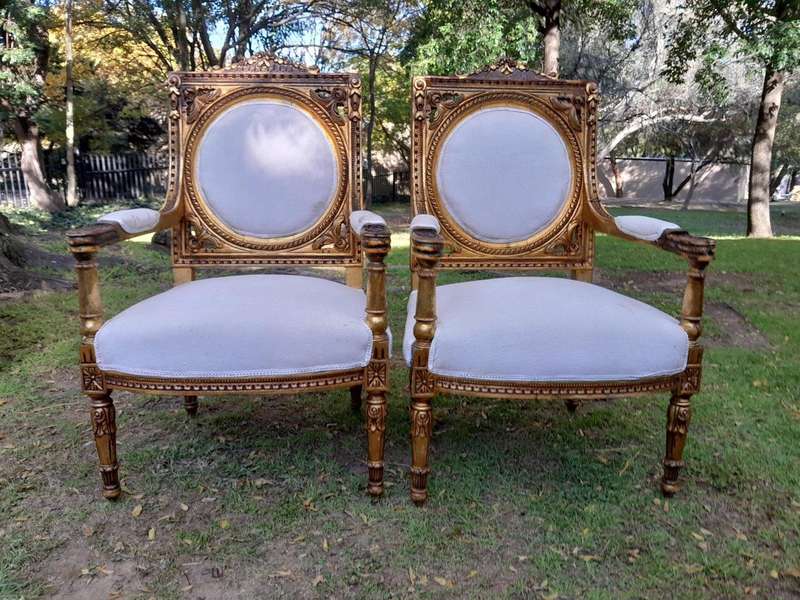 A 20th Century French Style Ornately Carved Gilt Wood Set Comprising a Settee and Pair of Armchairs