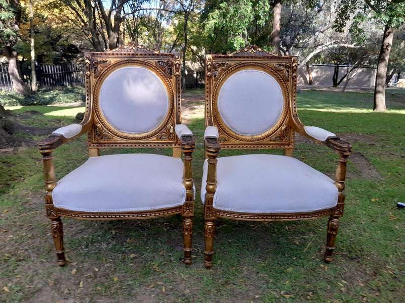 A 20th Century French Style Ornately Carved Gilt Wood Set Comprising a Settee and Pair of Armchairs