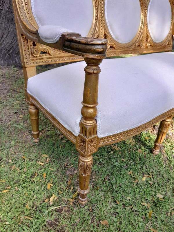 A 20th Century French Style Ornately Carved Gilt Wood Set Comprising a Settee and Pair of Armchairs