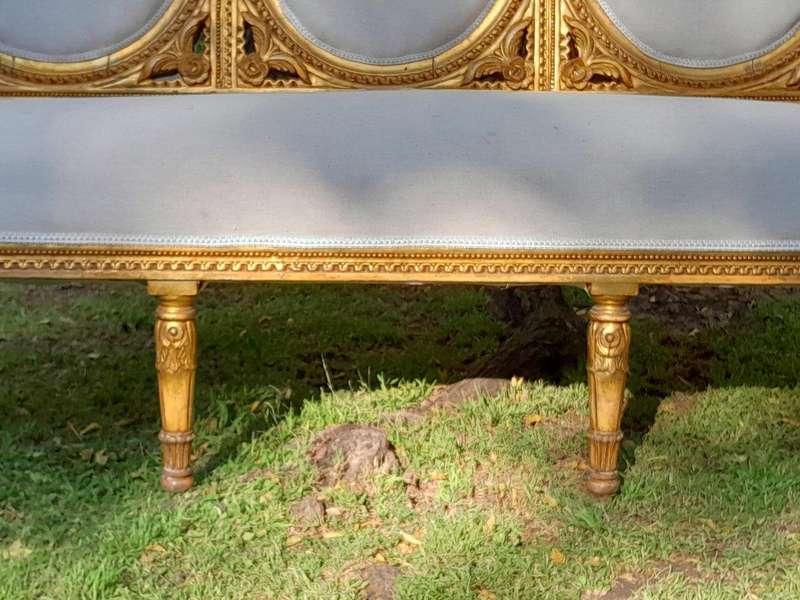 A 20th Century French Style Ornately Carved Gilt Wood Set Comprising a Settee and Pair of Armchairs