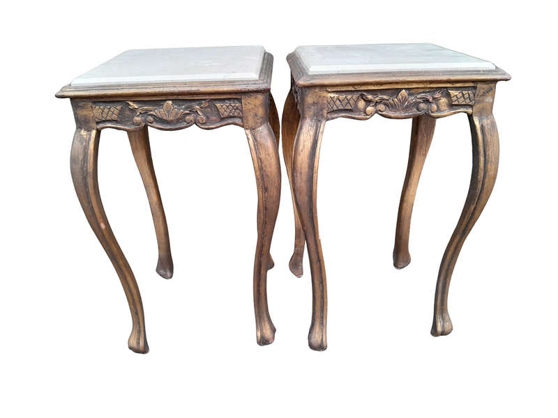 A 20TH Century French Style Pair Of Carved And Gilded Side Tables With Marble Tops