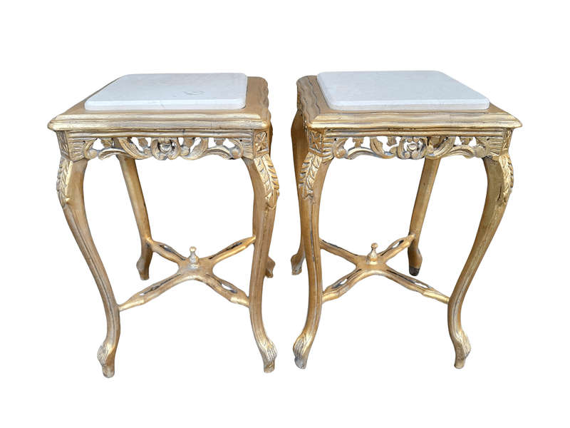 A 20TH Century French Style Pair Of Carved And Gilded Side Tables With Marble Tops