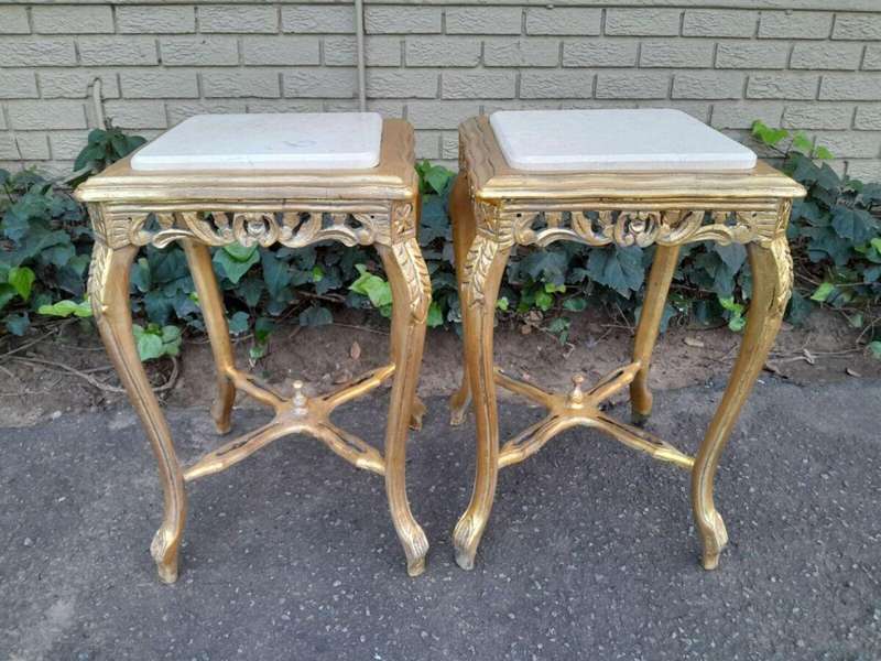 A 20TH Century French Style Pair Of Carved And Gilded Side Tables With Marble Tops