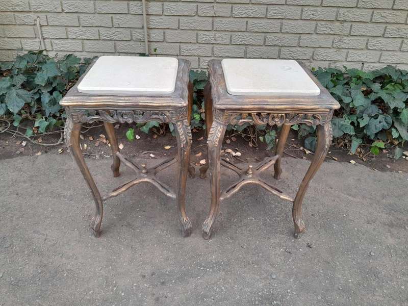 A 20TH Century French Style Pair Of Carved And Gilded Side Tables With Marble Tops