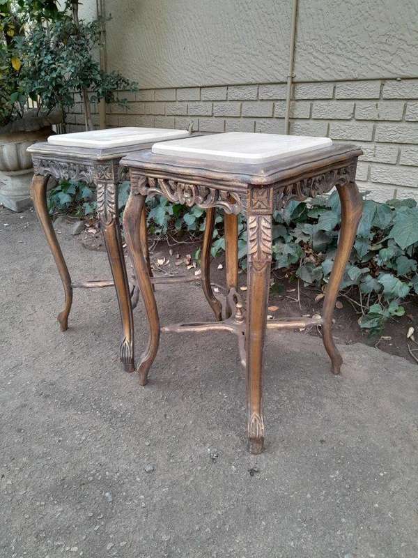 A 20TH Century French Style Pair Of Carved And Gilded Side Tables With Marble Tops