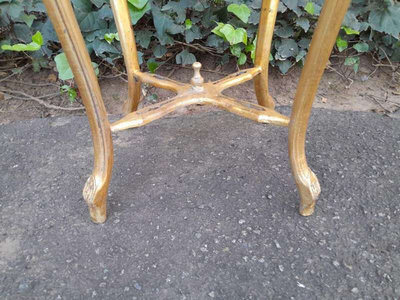 A 20TH Century French Style Pair Of Carved And Gilded Side Tables With Marble Tops