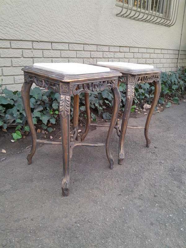 A 20TH Century French Style Pair Of Carved And Gilded Side Tables With Marble Tops