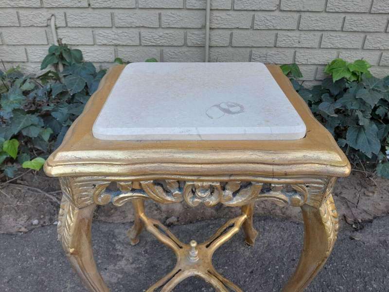 A 20TH Century French Style Pair Of Carved And Gilded Side Tables With Marble Tops