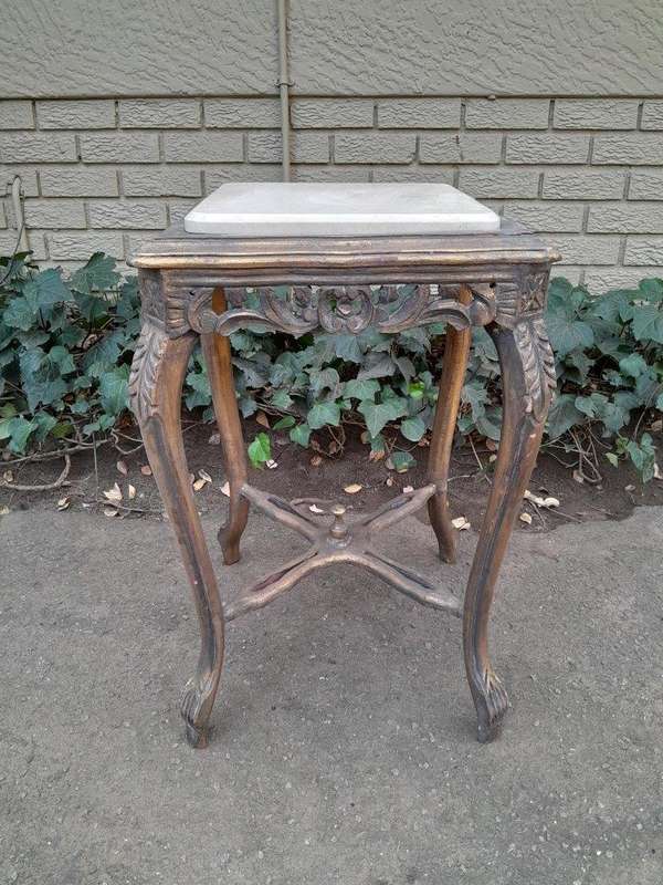 A 20TH Century French Style Pair Of Carved And Gilded Side Tables With Marble Tops