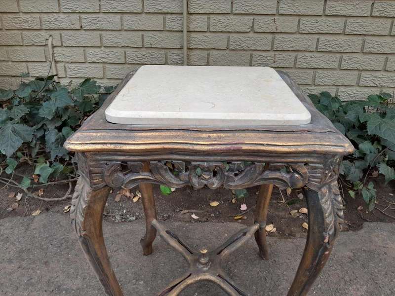 A 20TH Century French Style Pair Of Carved And Gilded Side Tables With Marble Tops