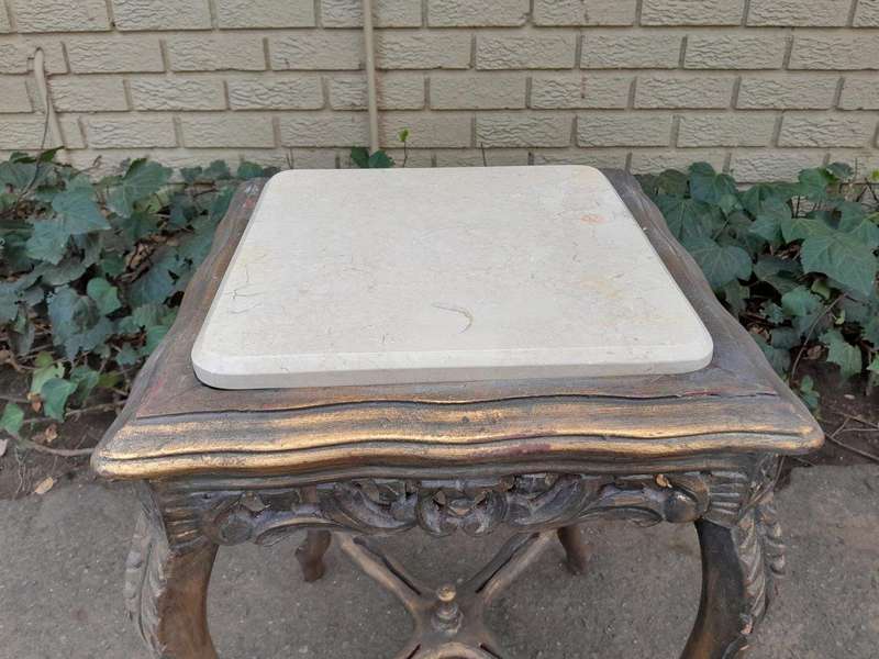 A 20TH Century French Style Pair Of Carved And Gilded Side Tables With Marble Tops