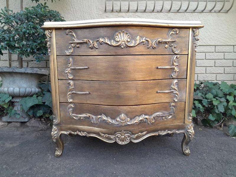 A French Style Ornate and Gilded Chest of Drawers with Marble Top