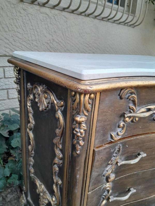 A French Style Ornate and Gilded Chest of Drawers with Marble Top