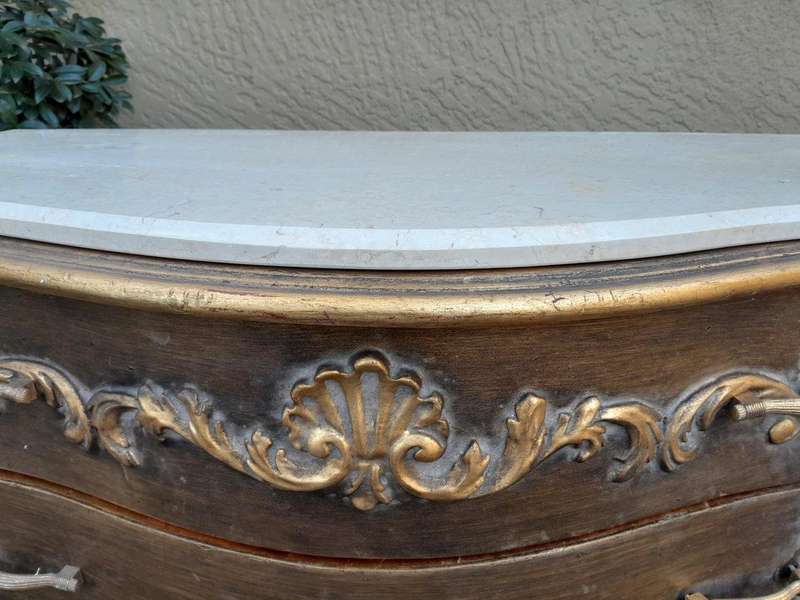 A French Style Ornate and Gilded Chest of Drawers with Marble Top