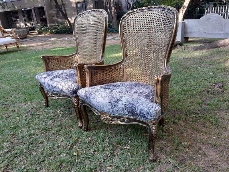 A 20th Century Pair of French Style Gilt Wood Rattan Arm Chairs
