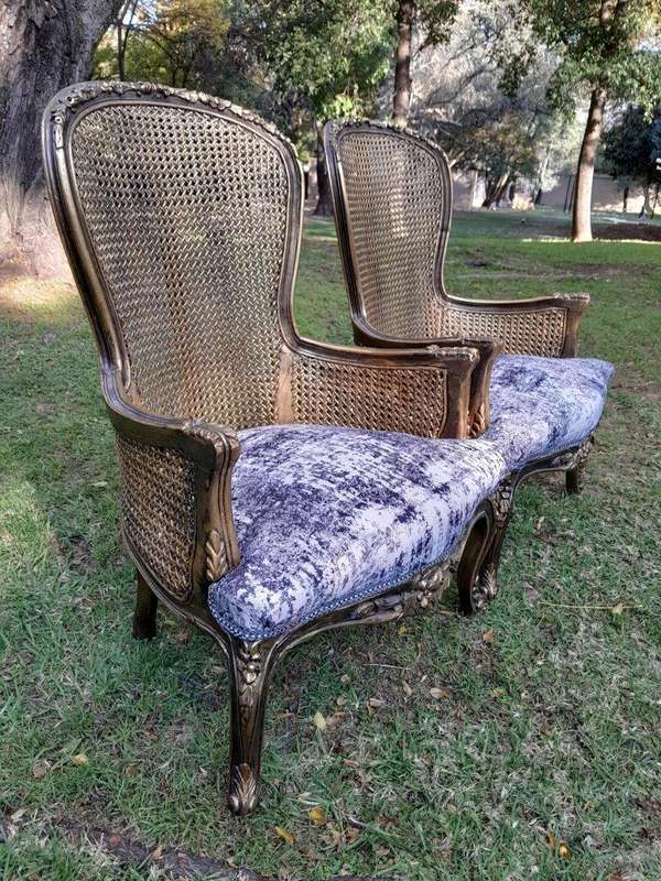 A 20th Century Pair of French Style Gilt Wood Rattan Arm Chairs