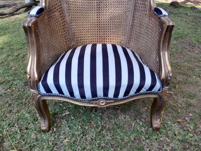 A Pair of 20th Century French Style Gilt Wood Arm Chairs with Rattan Back