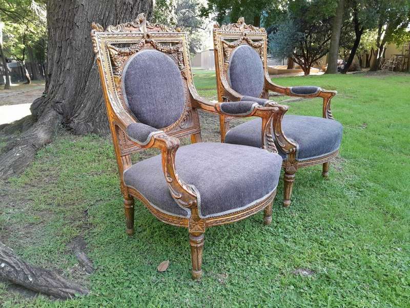 A Pair Of 20th Century French Style Ornately Carved Gilt Wood Arm Chairs