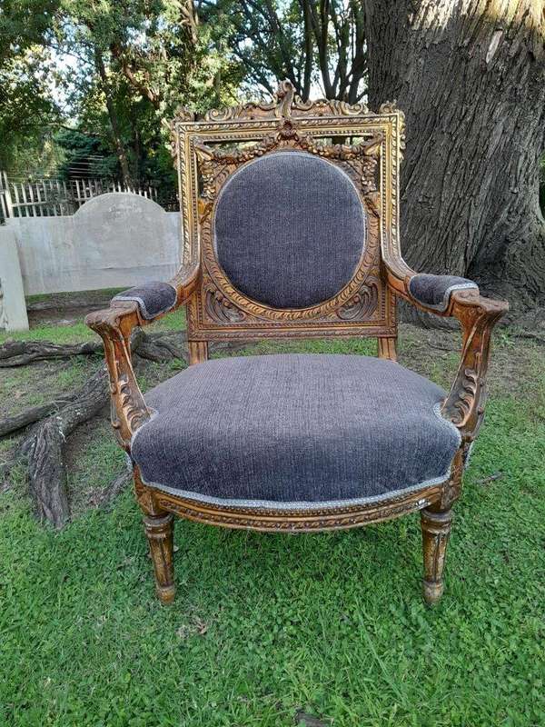 A Pair Of 20th Century French Style Ornately Carved Gilt Wood Arm Chairs