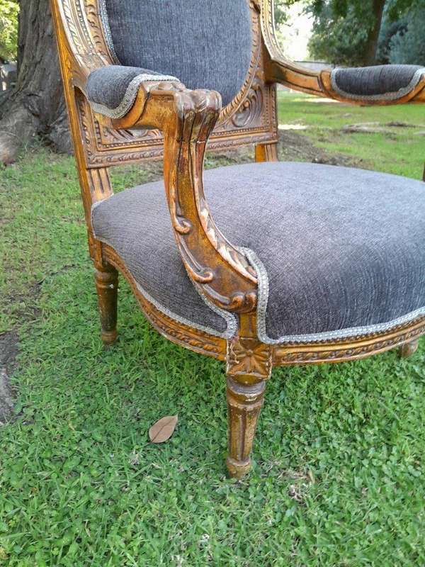 A Pair Of 20th Century French Style Ornately Carved Gilt Wood Arm Chairs