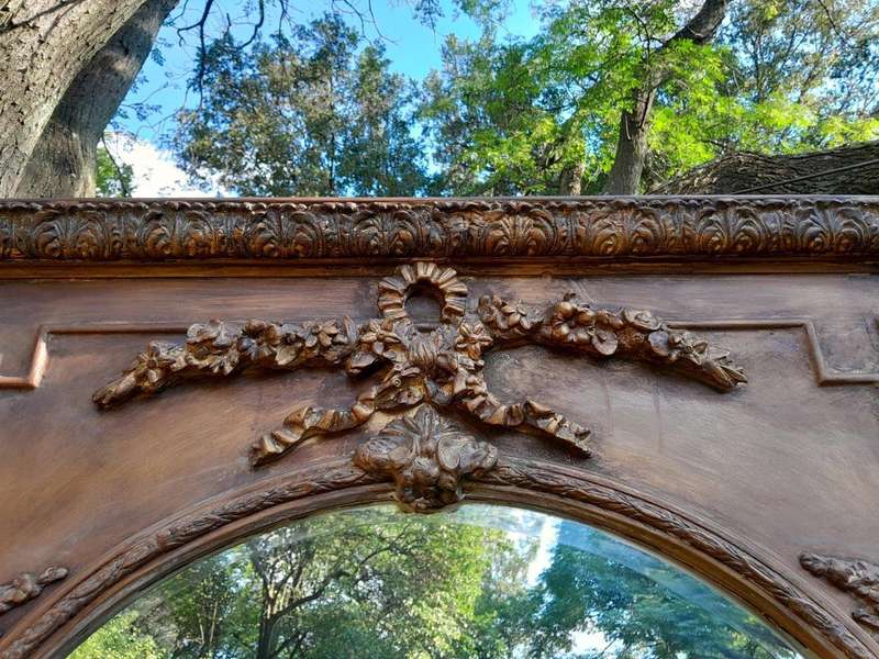 A French Style Ornately Carved And Gilded Bevelled Mirror Of Large Proportions