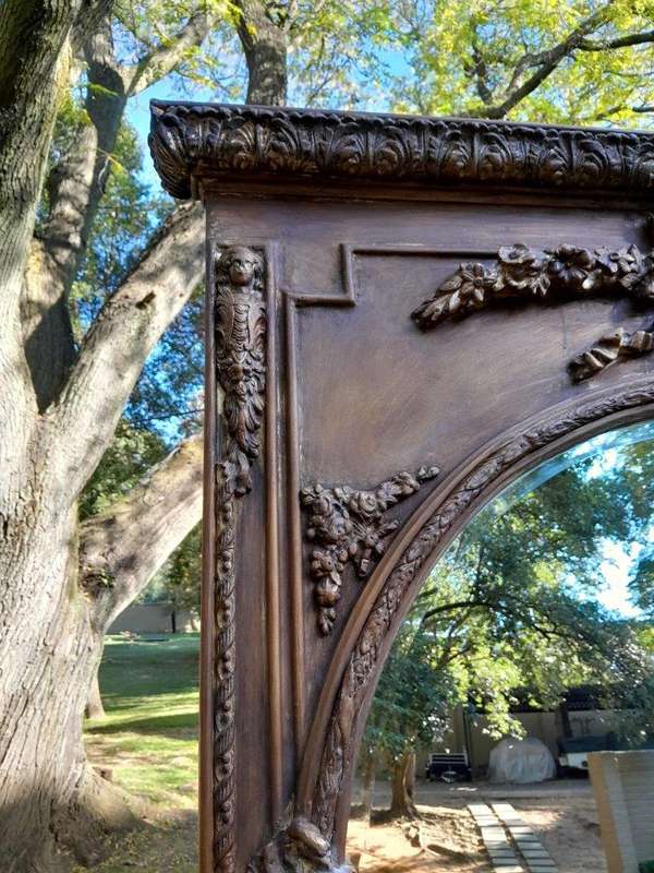 A French Style Ornately Carved and Gilded Bevelled Mirror of Large Proportions