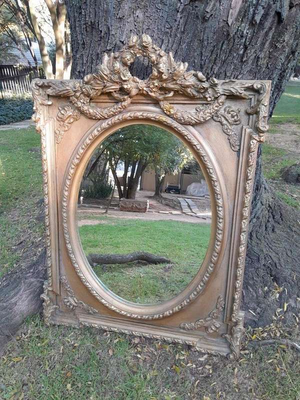 A French Rococo Style Ornately Carved & Gilded Bevelled Mirror