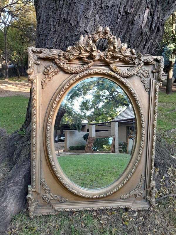 A French Rococo Style Ornately Carved & Gilded Bevelled Mirror