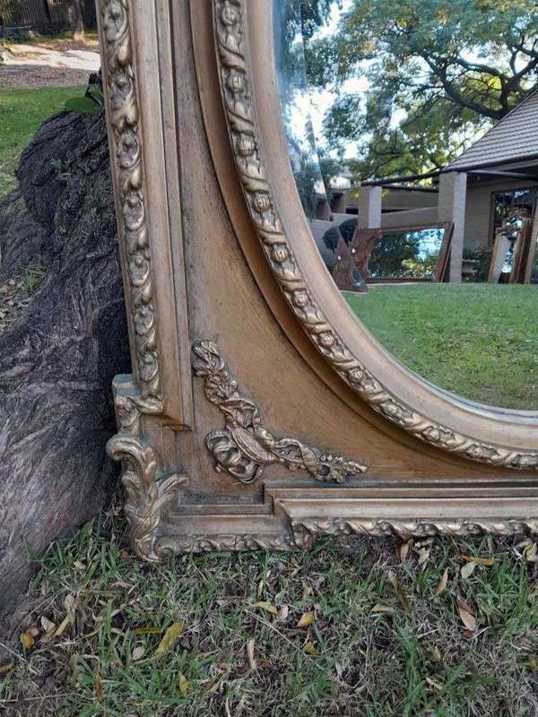 A French Rococo Style Ornately Carved & Gilded Bevelled Mirror