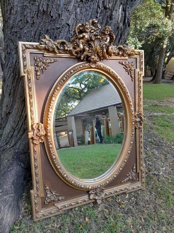 A French Rococo Style Ornately Carved & Gilded Bevelled Mirror