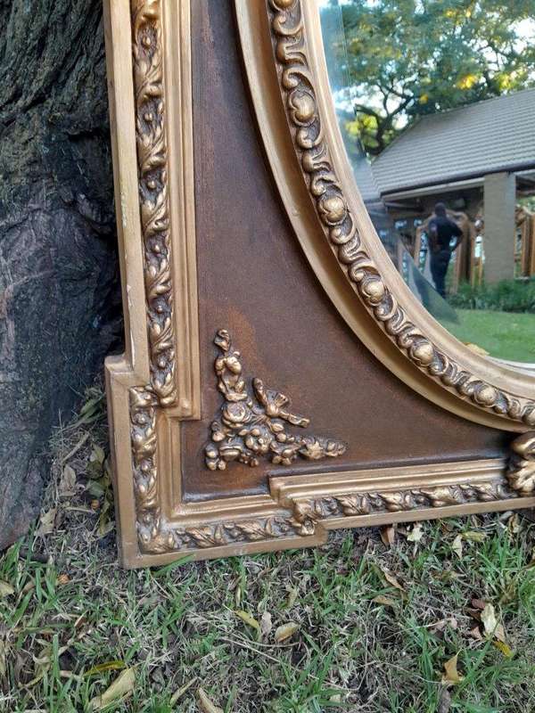 A French Rococo Style Ornately Carved & Gilded Bevelled Mirror