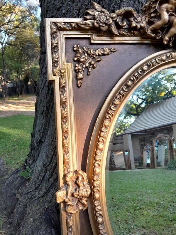 A French Rococo Style Ornately Carved & Gilded Bevelled Mirror