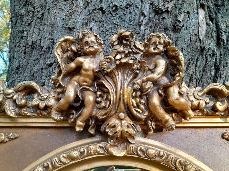 A French Rococo Style Ornately Carved & Gilded Bevelled Mirror