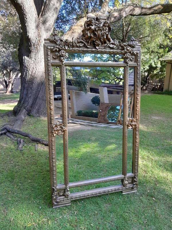 A French Rococo Style Ornately Carved & Gilded Large Bevelled Mirror