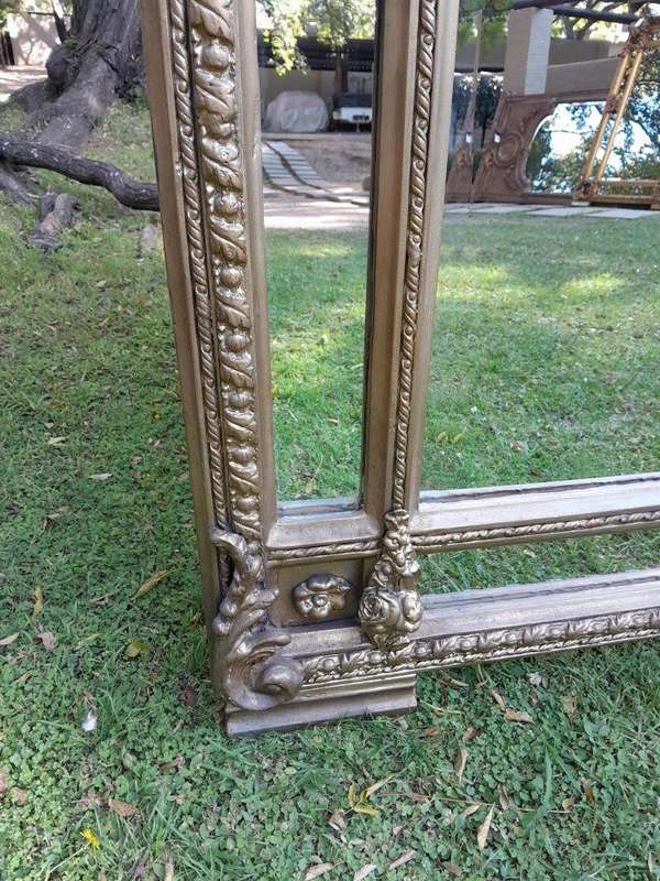 A French Rococo Style Ornately Carved & Gilded Large Bevelled Mirror