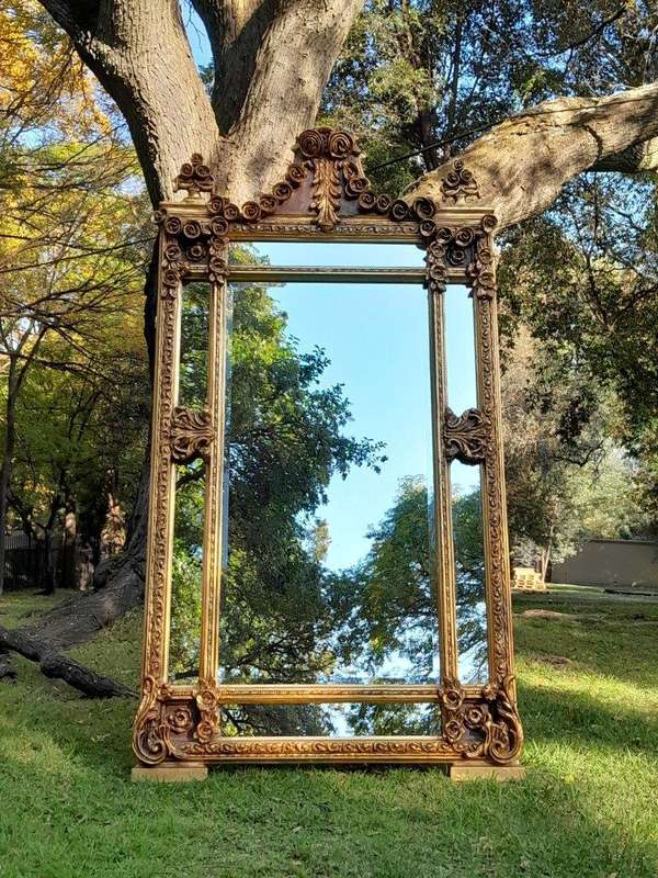 A French Rococo Style Ornately Carved & Gilded Bevelled Mirror